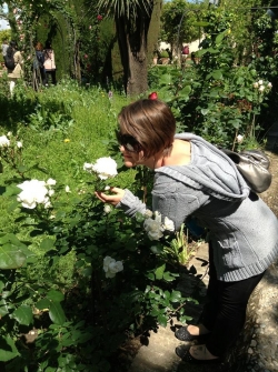 woman sniffing flowers